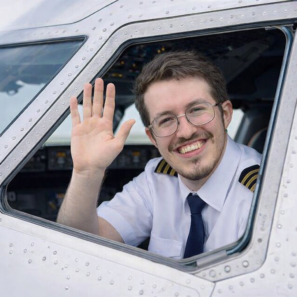 Pierre waving from cockpit